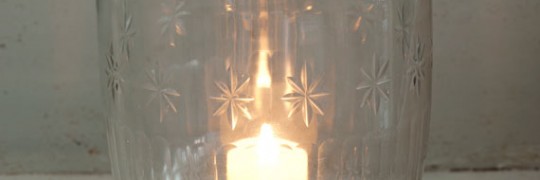 Large etched storm lantern with candle